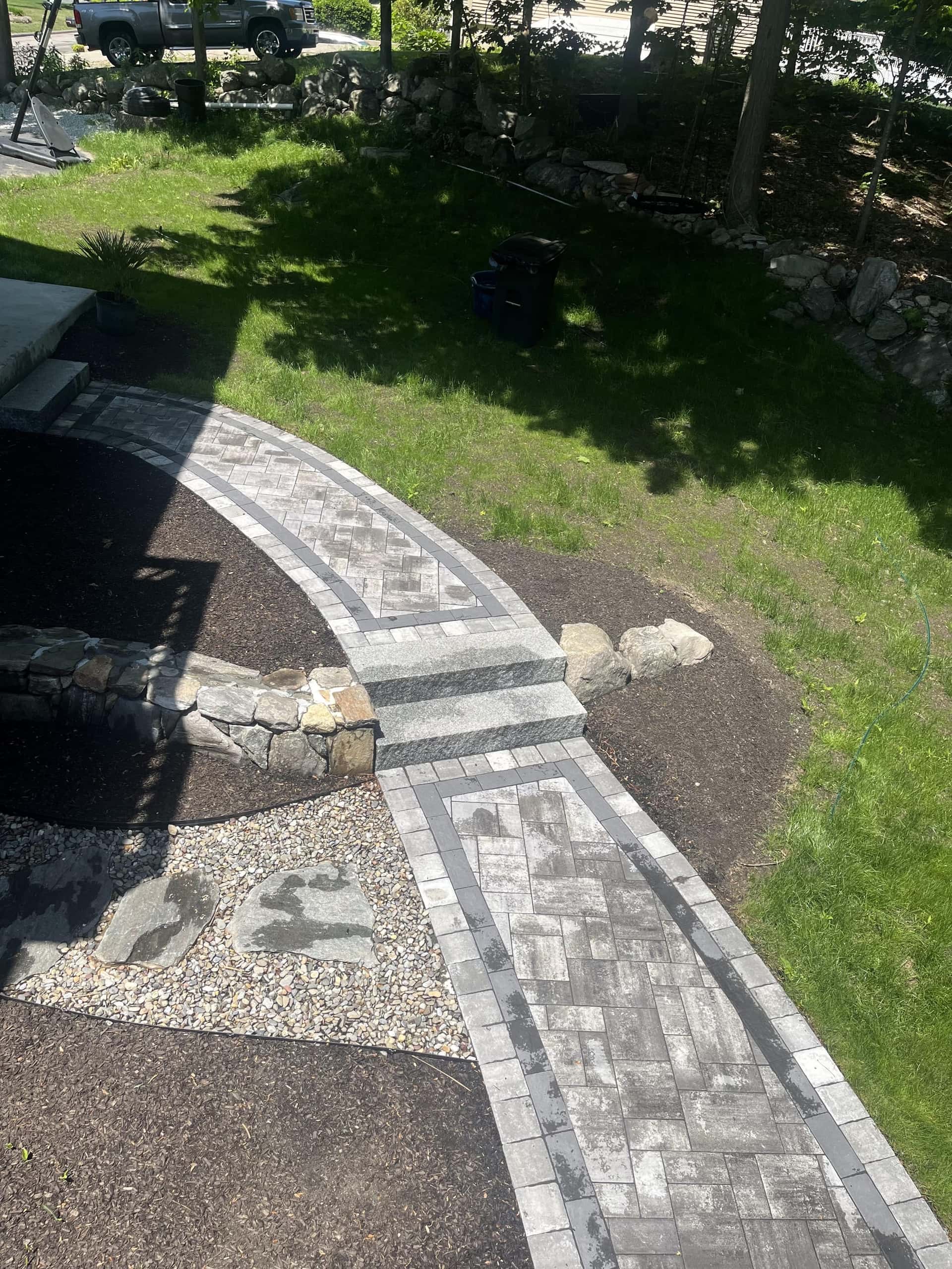 Stone walkway and steps installation project in Massachusetts by YellowStone Masonry Group