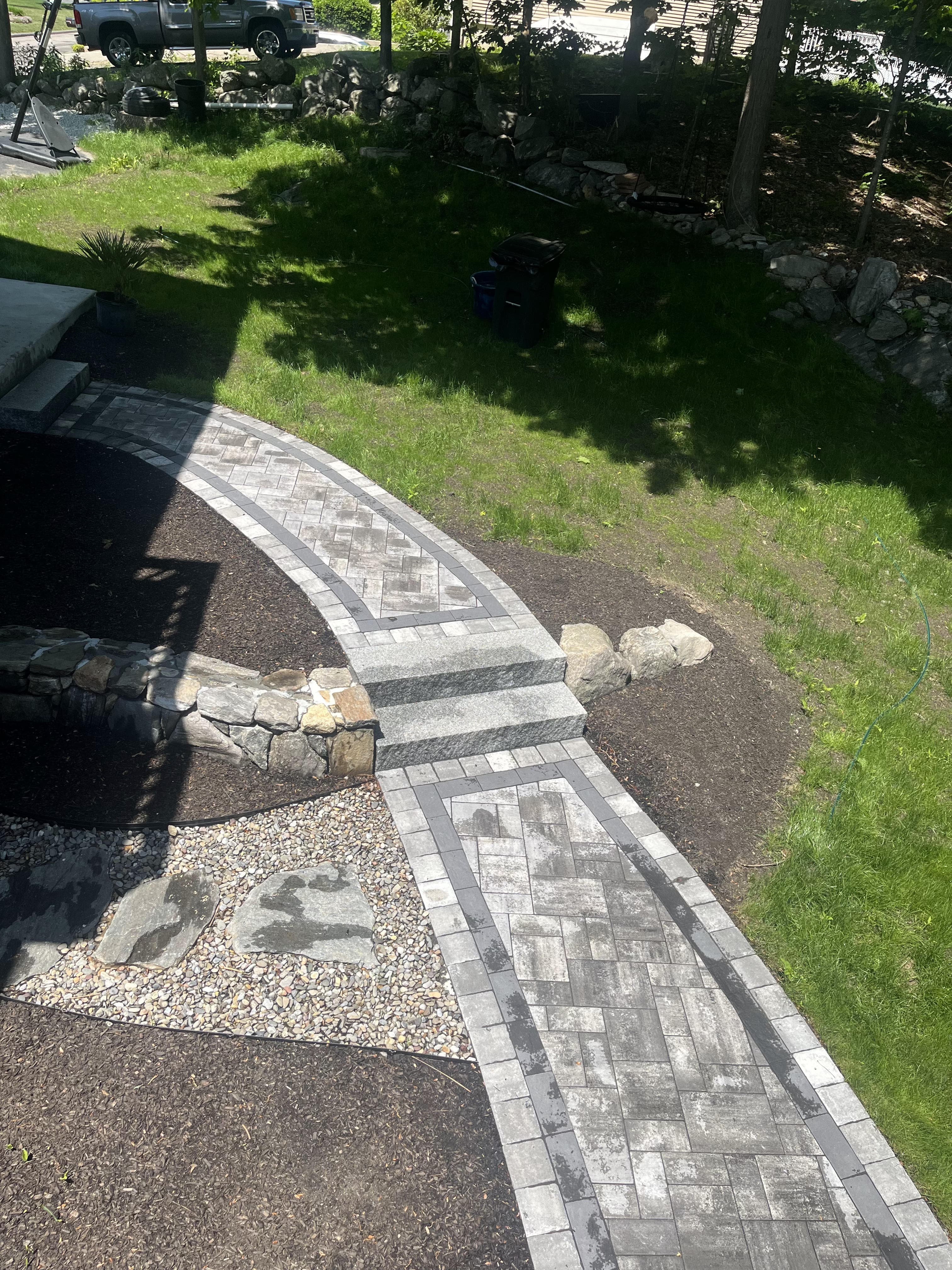 Stone walkway and steps installation project in Massachusetts by YellowStone Masonry Group